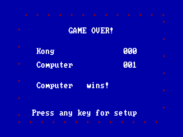 The final scorecard full screen, inside a border of red sparkles: GAME OVER!, Kong 000, Computer 001, Computer wins!, and Press any key for setup.
