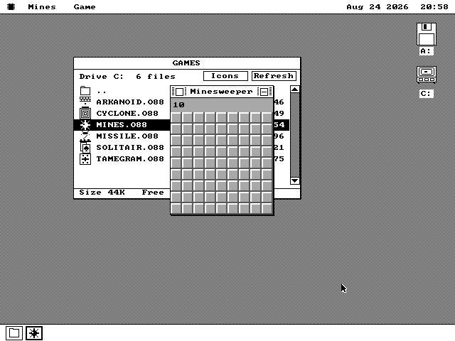 Minesweeper open on the os8088 desktop in front of the GAMES folder on drive C, with its icon showing in the strip along the bottom of the screen.